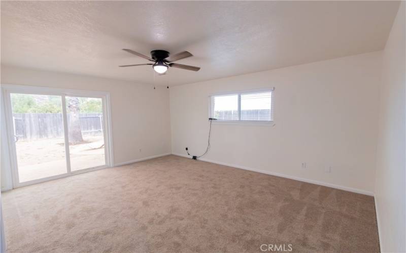 Primary bedroom with backyard access