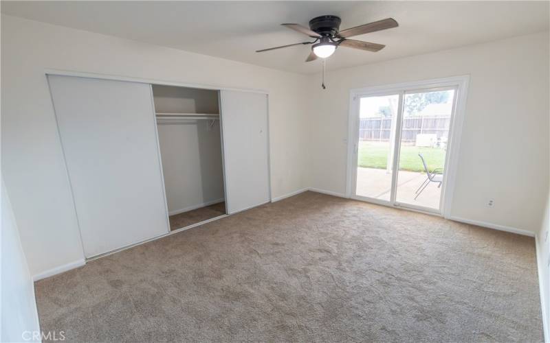 Bedroom #2 - Jr Suite with sliding door to side yard.