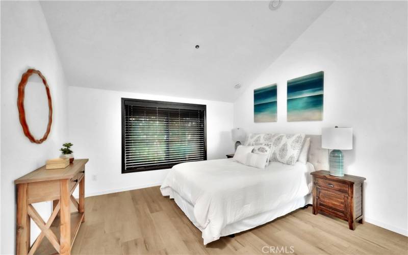 Bedroom with vaulted ceilings