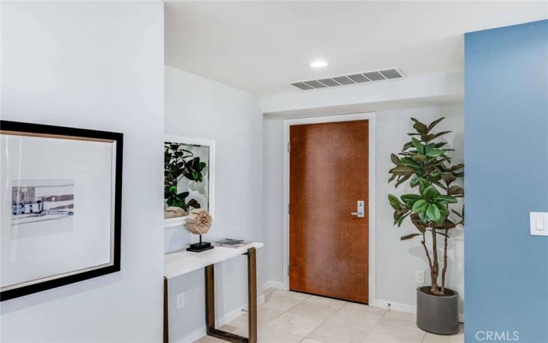 Entry hall at beautiful Unit 206. An abundance of community amenities awaits.