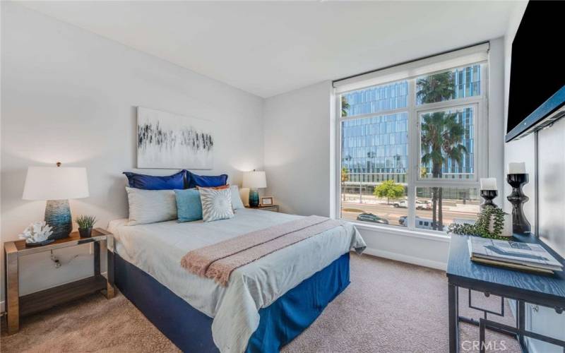 Bedroom Two, on the complete opposite side of the home, is large enough for a Queen-sized bed and has a great Civic Center city lights view.