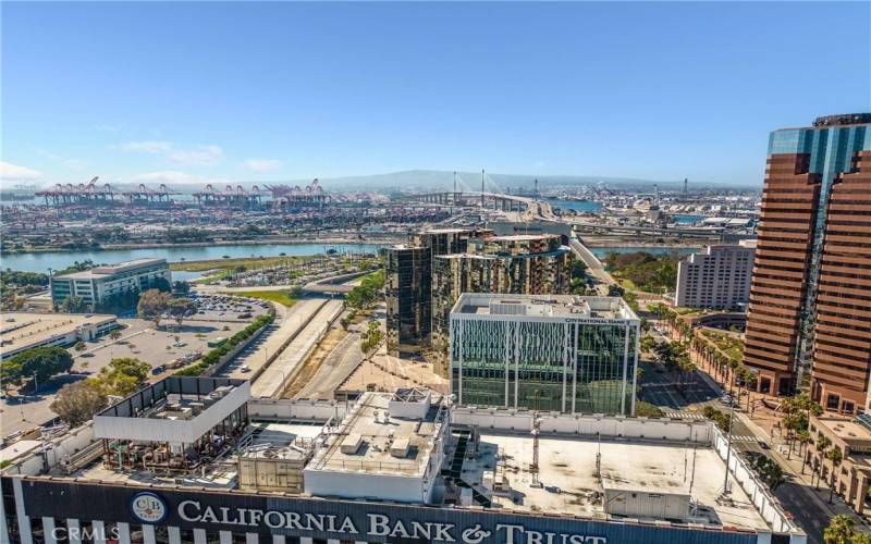 Aerial shot looking to The Port of Long Beach, the new $1.47 Billion Gerald Desmond/International City Gateway Bridge and the Palos Verdes Hills.