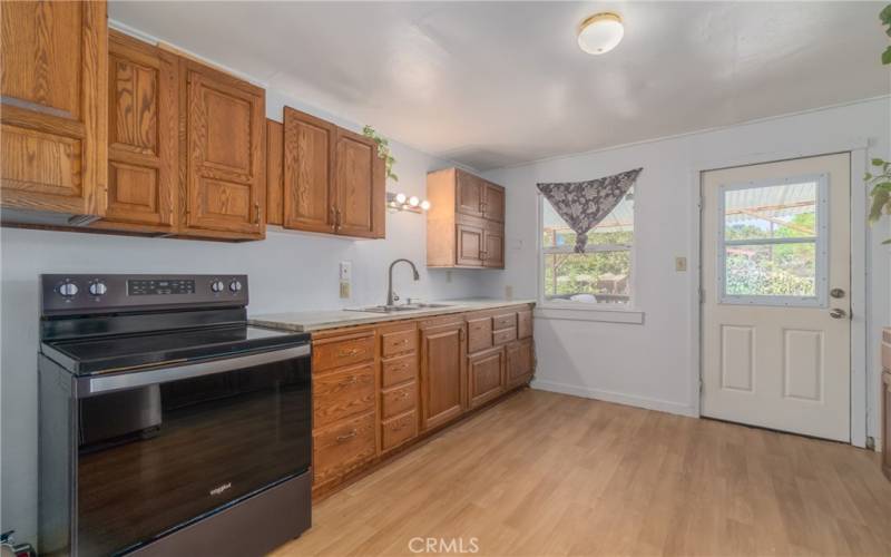 Kitchen with backdoor to porch.