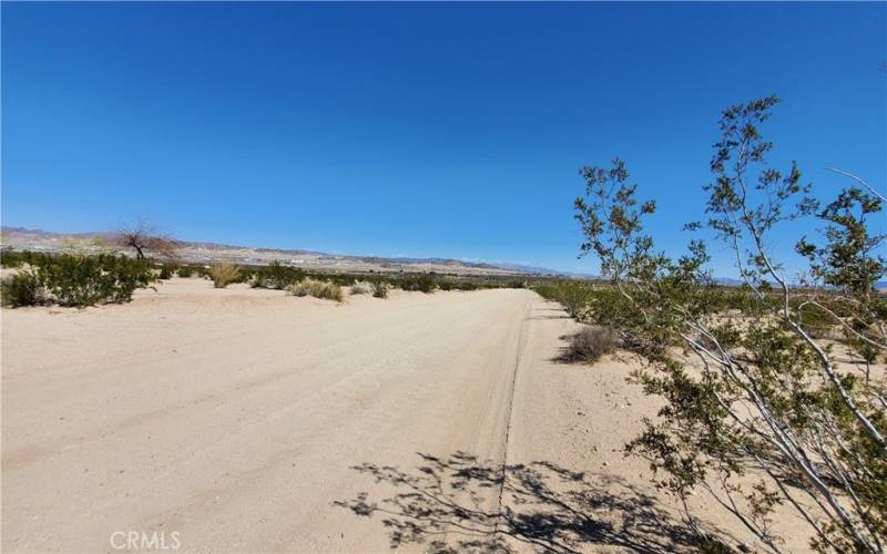 Looking east from the east corner of the parcel Taylor Ln is the road pictured.