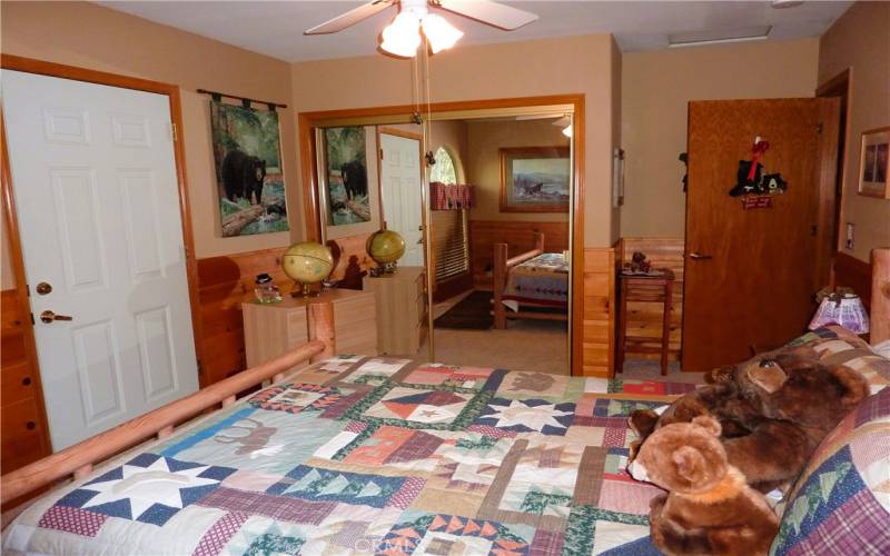 Bedroom #2 is at the end of the hallway, and it has an access door that is on the left side of the home.