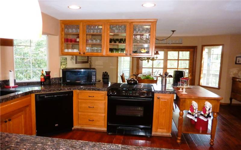 Built in range/oven and dishwasher in the kitchen. The kitchen is open to the dining nook which is opposite the family room.