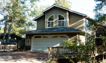 Welcoming home in the San Moritz area a block away from Lake Gregory. you can access the home directly from the garage or the walkway to the front door, and there are no stairs to climb.