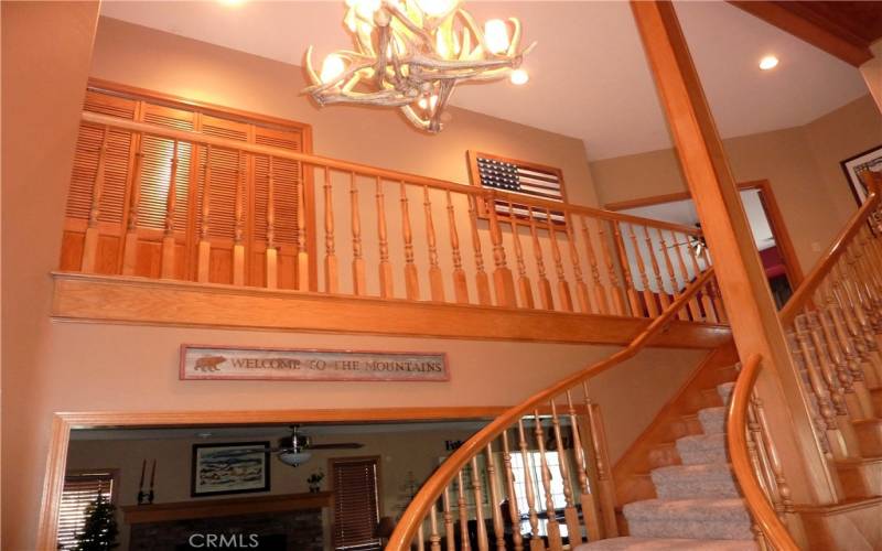 The balcony overlooks the living room and the foyer.