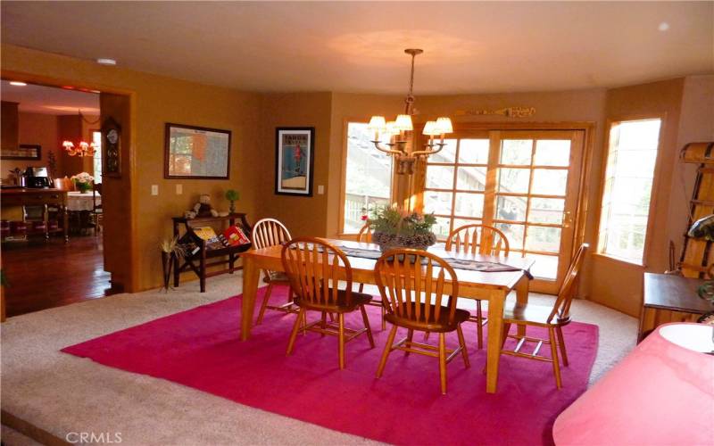 The dining room is on the main level and has easy access to both the kitchen and the deck on the rear of the home.