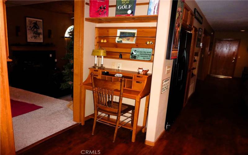 Between the kitchen and dining room is a small place for a desk or work area.