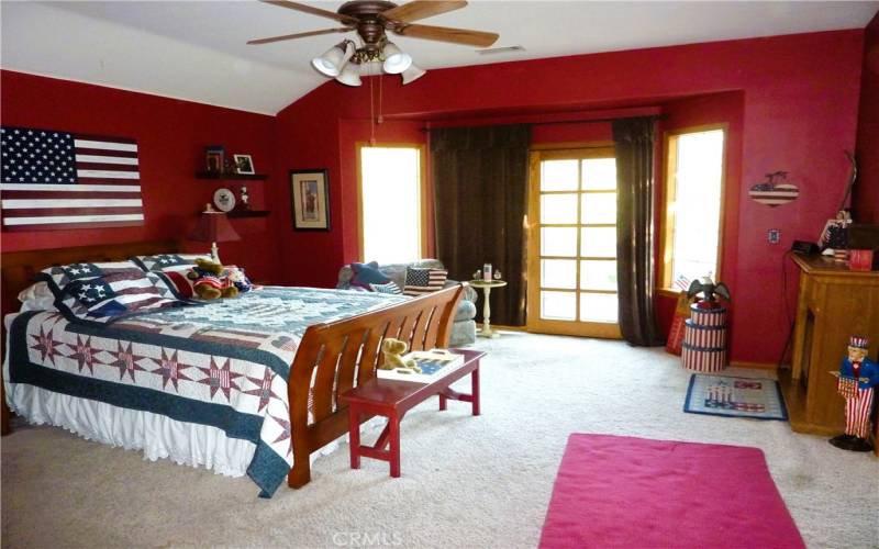 The master bedroom is located at the top of the stairs and is one of the highlights of the home.