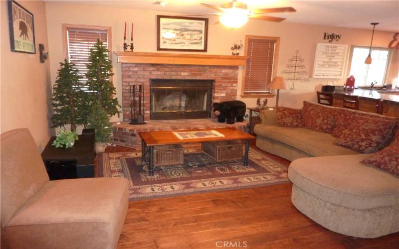 As you enter the home through the garage, you walk past the large half bath and into the family room. The family room has a pretty brick fireplace with a gas starter.