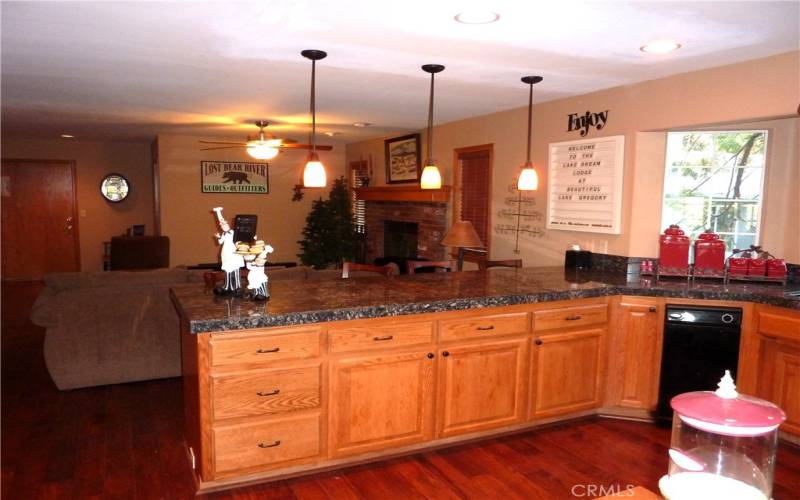 There's a granite breakfast bar that separates the kitchen from the fmaily room.