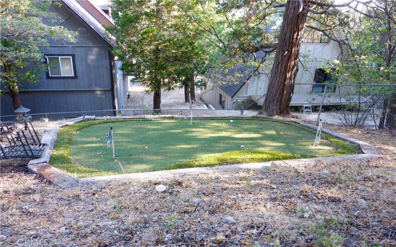 The putting green in the back yard is one of the treats.