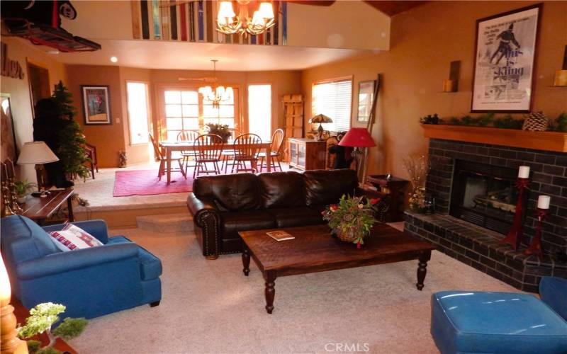 Also, from the front door, you can look across the sunken living room to the dining room and the rear of the home.