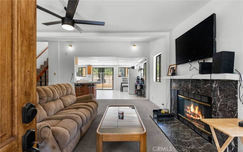 Guest House Living Room Interior from Entrance. The fire inside Fireplace is Virtually Staged.