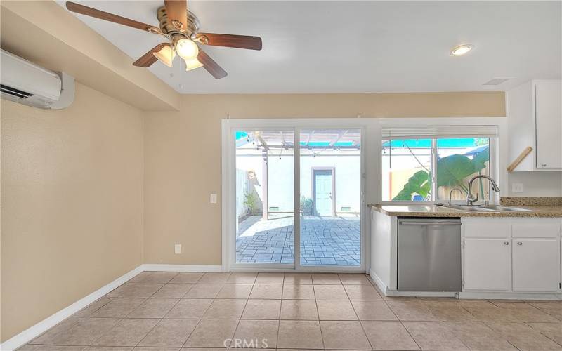 Dining area with sliding door leading to outdoor patio