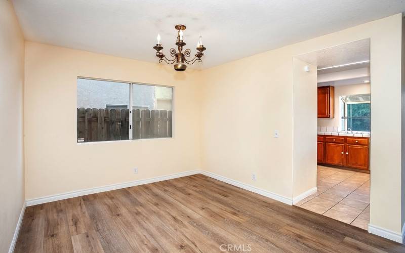 The dining room fittingly adjoins the kitchen and with its sparkling window, drop-down lighting and complementary wood-grained vinyl flooring, it is perfect for any occasion.