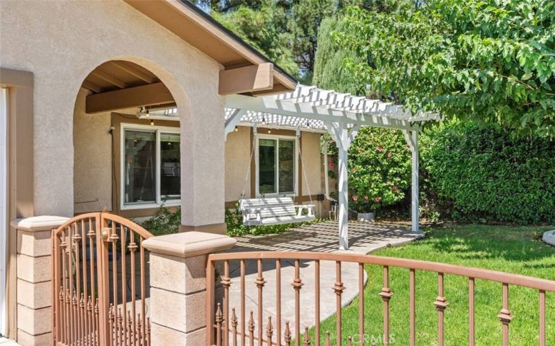 Entry to gated courtyard, porch and front door.