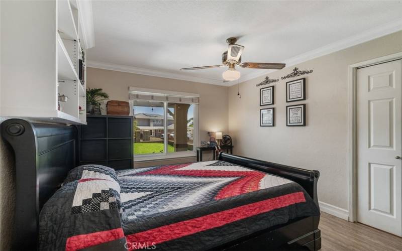 Nicely sized secondary bedroom with built-ins overlooks the front courtyard.