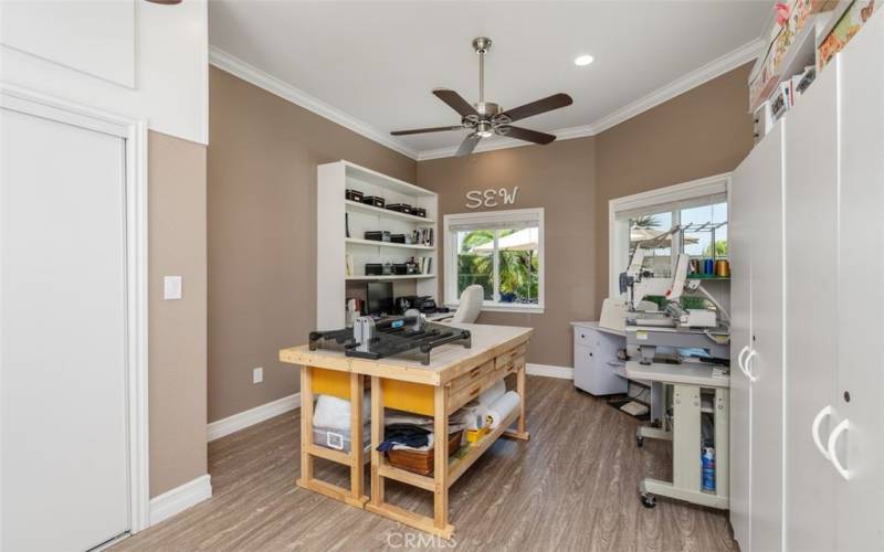 This seamless room addition has high ceilings with fan, and large closet & cabinetry for storage