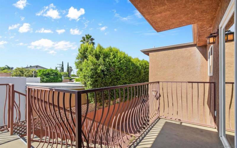 Curved wrought iron railings along the balcony