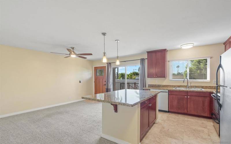 Open floor plan with sliding doors out to balcony