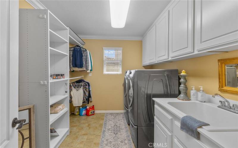 Upstairs laundry room with large sink