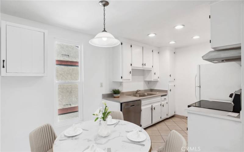 Kitchen area with eating nook - This photo is virtually staged for representative purposes.