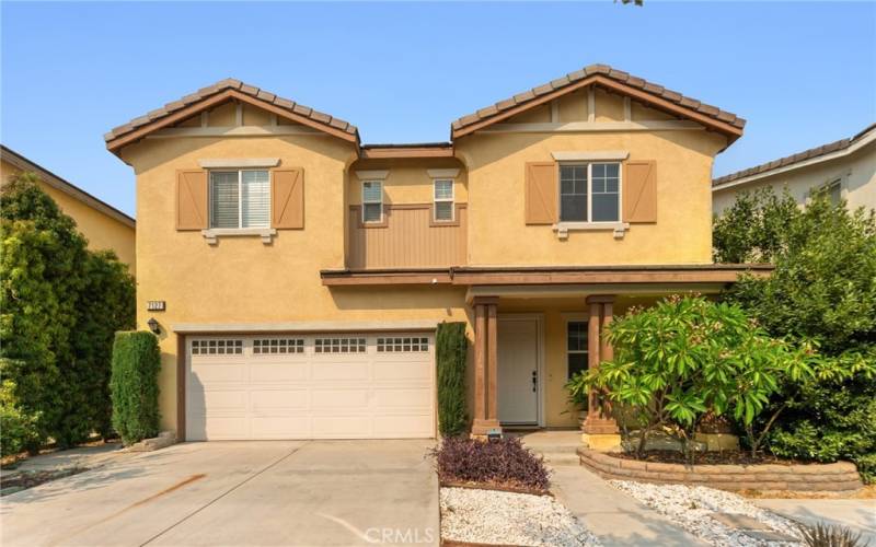 This inviting two-story home features a welcoming front porch, a spacious two-car garage, and attractive landscaping. The exterior is highlighted by classic shutters and a well-maintained façade, making it a perfect choice for comfortable family​​‌​​​​‌​​‌‌​​‌​​​‌‌​​​‌​​‌‌​​‌‌​​‌‌​​​​ living.