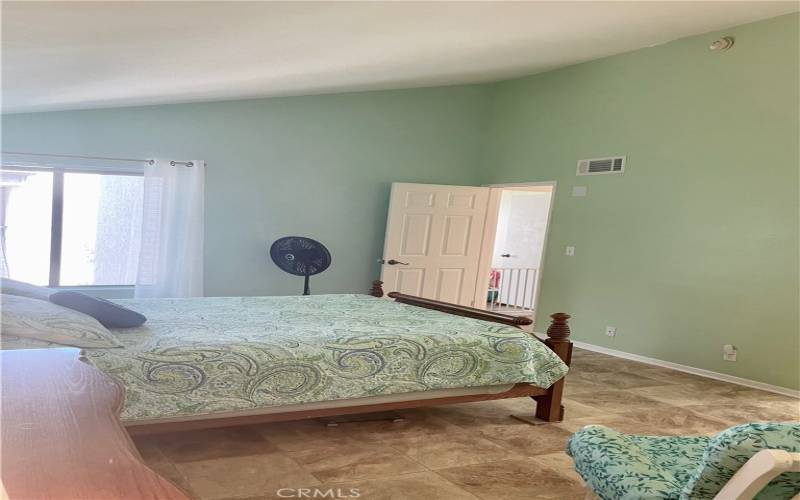 3rd picture of main bedroom with a view of high ceilings