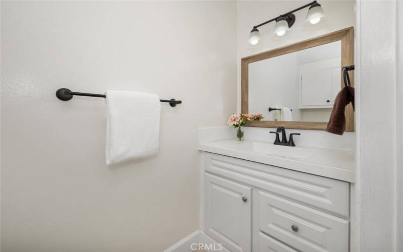 Powder room downstairs new vanity and fixtures.