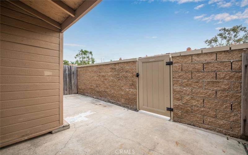 Private enclosed patio for outdoor living or a furry friend.