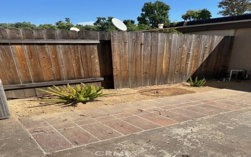 Back patio leads to 2 car garage