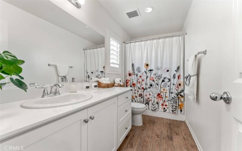 Bathroom upstairs with bathtub and shower