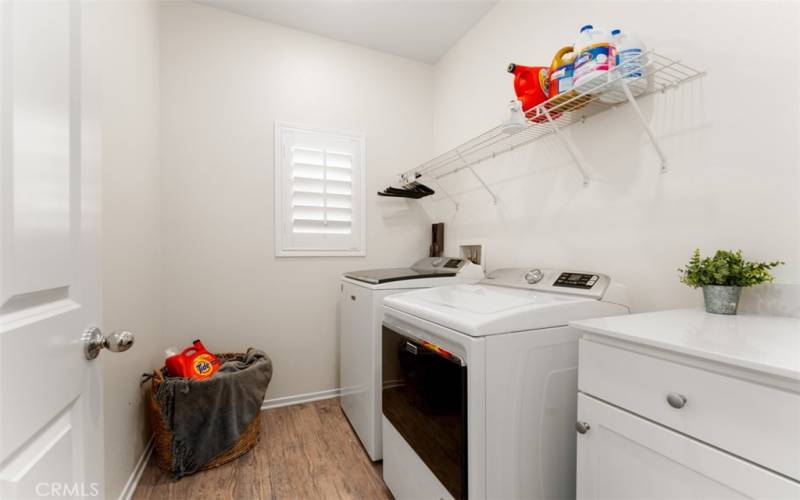 Large Laundry area with storage cabinets