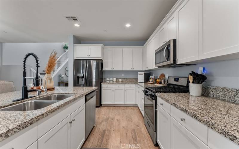 Large open kitchen with stainless steel appliances