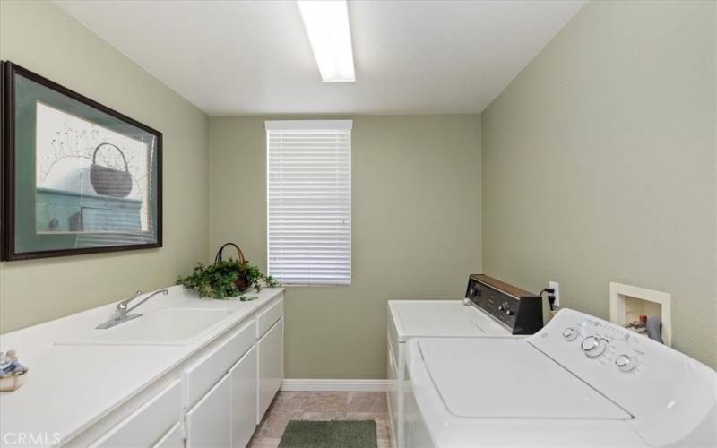 Indoor laundry room directly off kitchen