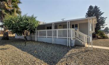 Welcome Home! Corner lot view with the upgraded covered front porch to enter the home.