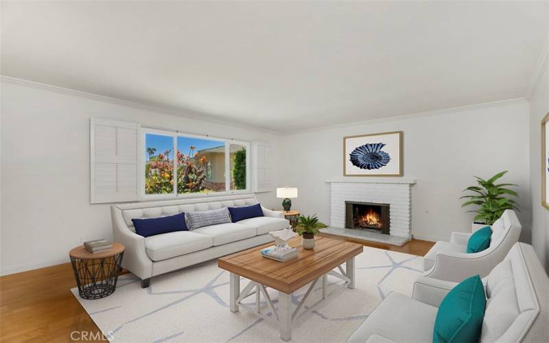 Living room with pretty brick fireplace. VIRTUALLY STAGED