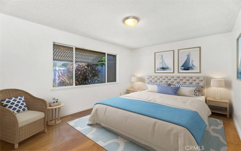 Secondary bedroom with view of back patio. VIRTUALLY STAGED