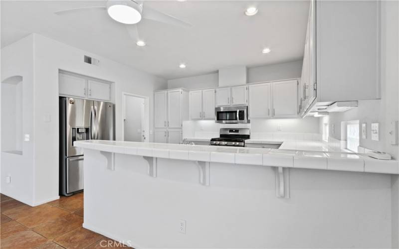 Closer view of breakfast bar and kitchen