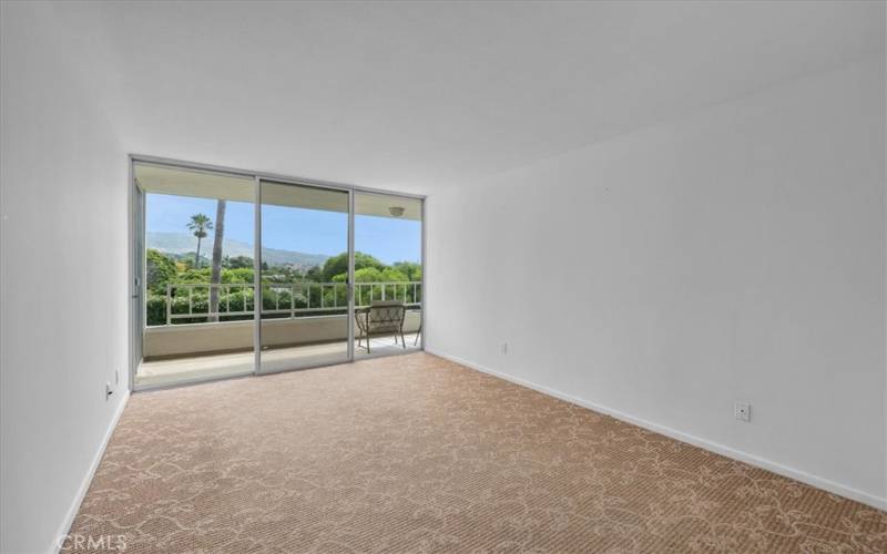 Spacious bedroom #2 w/ balcony access. More views of lush PV!