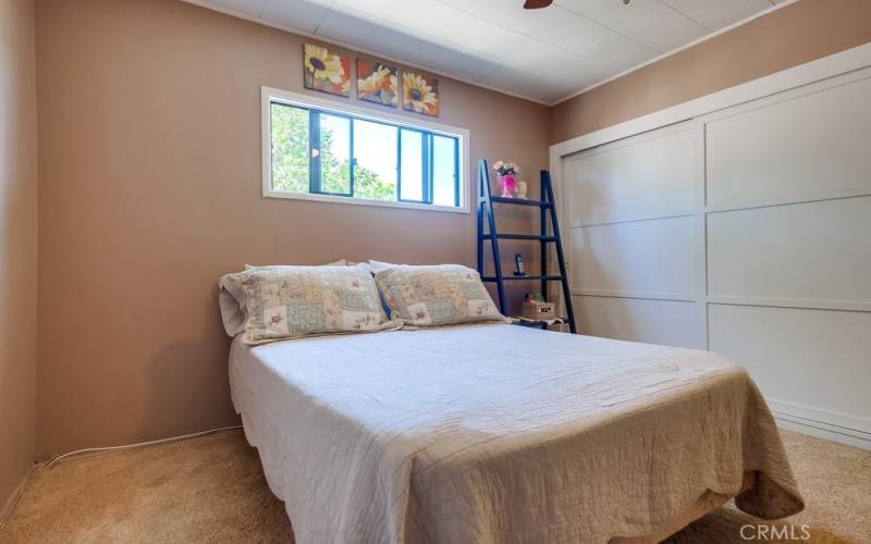 Double closet in back bedroom.