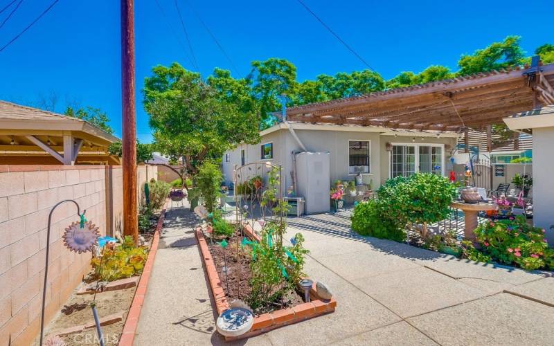 More built in planters and view along side of home.