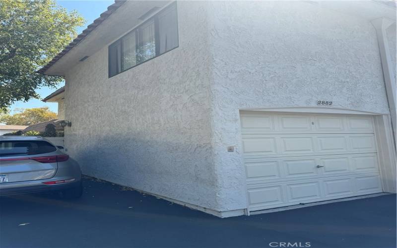 1 Car garage with dedicated parking on side.