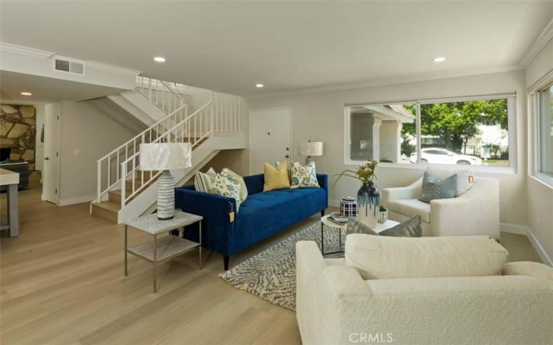 Looking toward the front door, the open stair way leads to the 4 upper bedrooms.