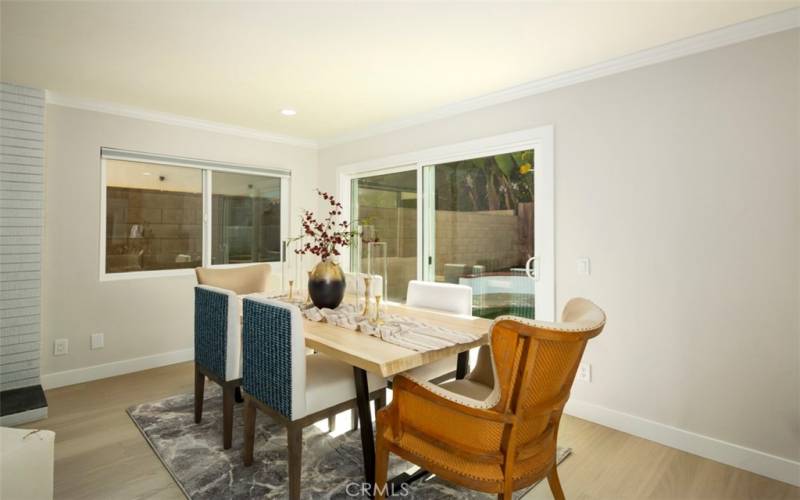 Large area to right of fire place creates a beautiful dining area. Open the slider to let the cooling evening breezes in.