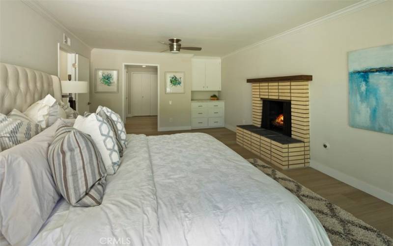 Primary Bedroom has a fireplace as well as a King size bed in it.