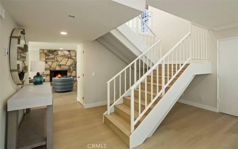 Don't you love the mid-century stairs!! There is a coat closet just past the stairs.